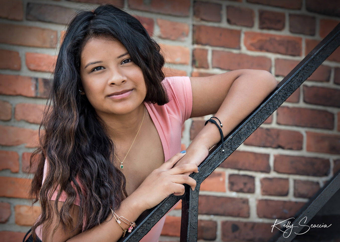 High School senior girl Downtown Rochester brick background on the stairs 