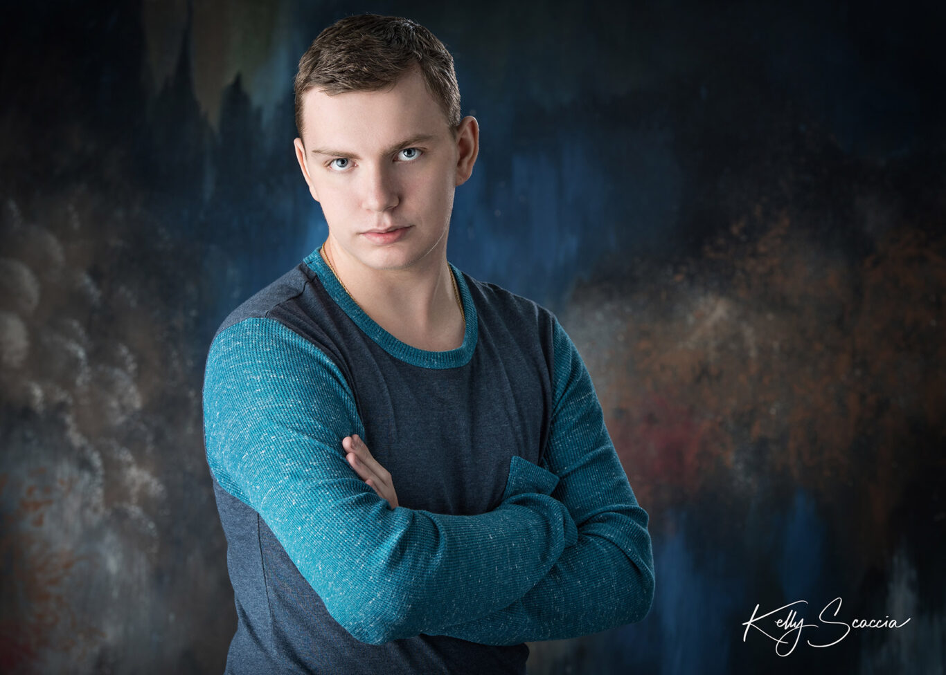 High School senior guy in the studio with a serious expression