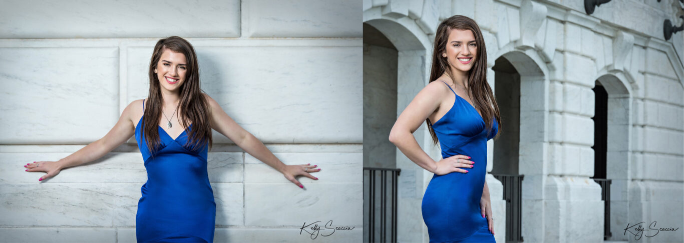 High School senior girl in front of white marble outside wearing blue spaghetti strap dress 